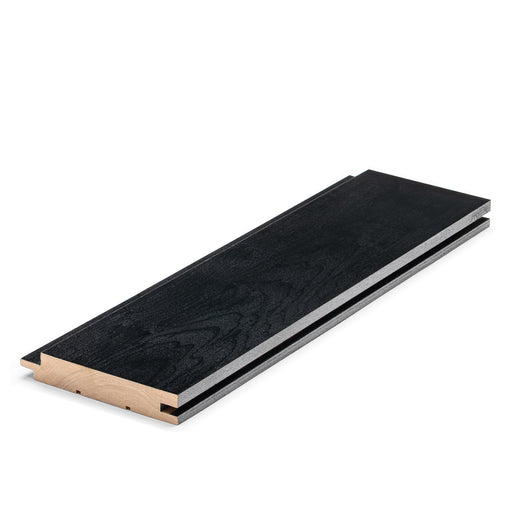 Aspen Midnight Black 1x4 tongue-and-groove paneling board laid at an angle, showing black face and light wood edge