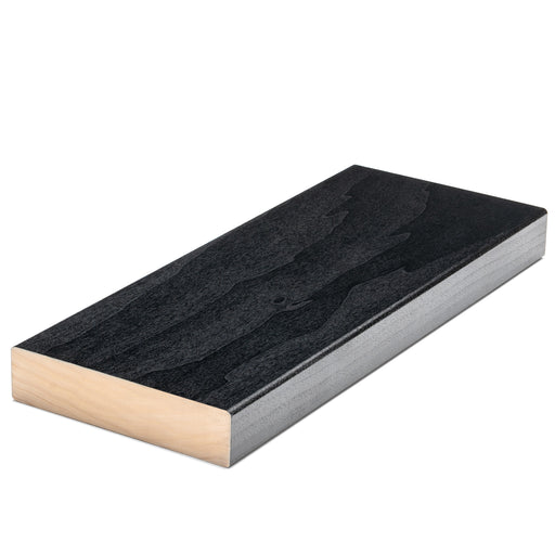 Aspen Midnight Black 2x5 bench board, angled view of dark grain face with pale natural wood end