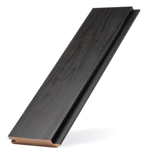 Aspen Midnight Black tongue-and-groove paneling board standing at an angle, showing dark face and groove edge