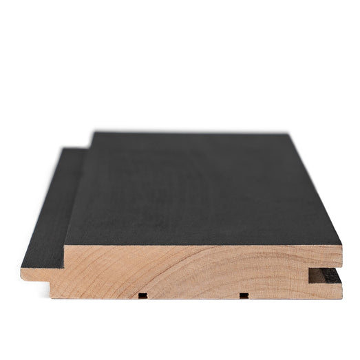 Aspen Midnight Black paneling board end view showing tongue and groove profile and raw wood cross-section
