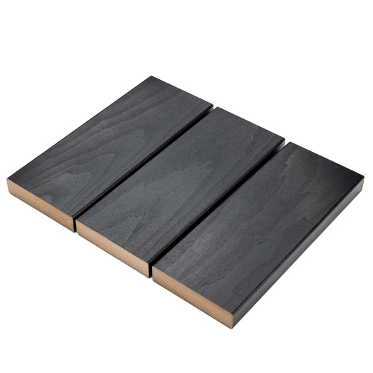 Three Aspen Midnight Black 2x5 bench boards side by side with small gaps, showing dark face grain and edges