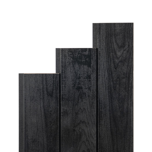 Aspen Midnight Black paneling boards in three stepped lengths, showing black face grain