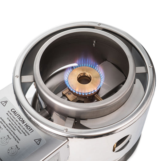 Burner flame inside the SaunaLife Titan SL1 heater base, seen from above with the stone basket removed