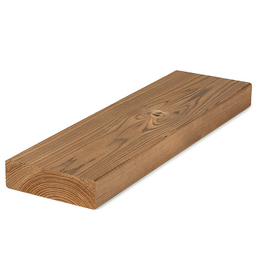 Thermo-Spruce 2x4 bench board resting at an angle, showing face grain with a knot and the end grain