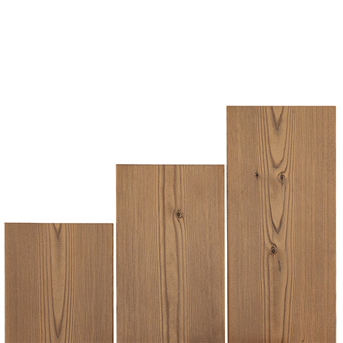 Three Thermo-Spruce 2x6 bench boards in stepped lengths, standing upright and showing grain and knots