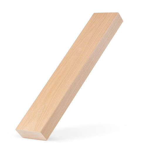 Alder 2x3 bench board propped at a steep angle against a white background, showing face grain and long edge
