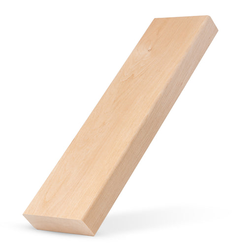 Alder 2x4 bench board standing tilted on one end, showing the pale face grain on a white background