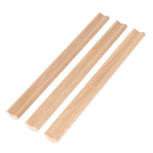Three Alder 1x2 Inside Corner Trim pieces side by side at an angle, each with a concave groove along its length