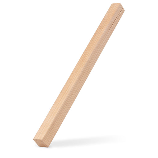 Alder 1x1 Trim piece leaning upright at an angle, casting a soft shadow on a white background