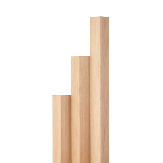 Alder 2x2 Outside Corner Trim pieces standing upright in stepped lengths, showing light vertical grain on the faces