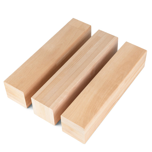 Three Alder 3x3 bench boards side by side at an angle, showing light, even grain on the long faces