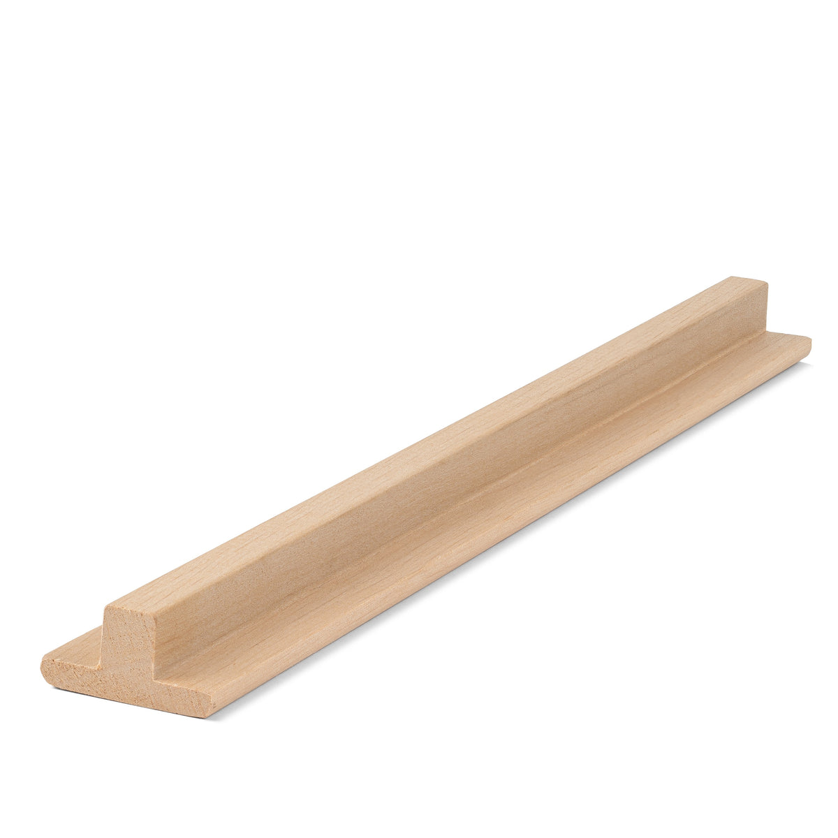 Alder 1x2 T-Molding piece lying flat, angled view showing the raised center rib and flat flange along its length
