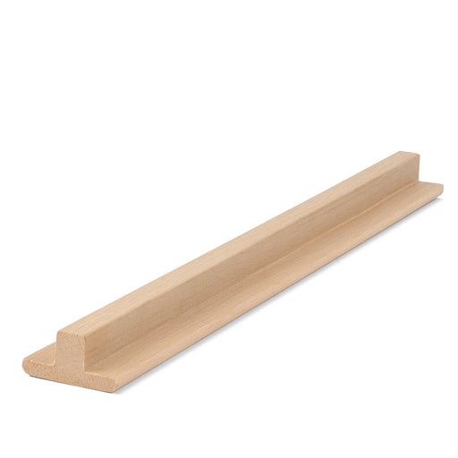 Alder 1x2 T-Molding piece lying flat, angled view showing the raised center rib and flat flange along its length