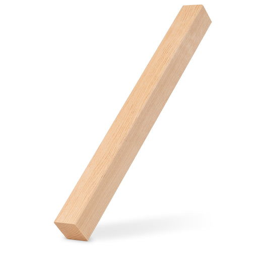 Alder 2x2 Trim piece leaning upright at an angle with a soft shadow beneath it