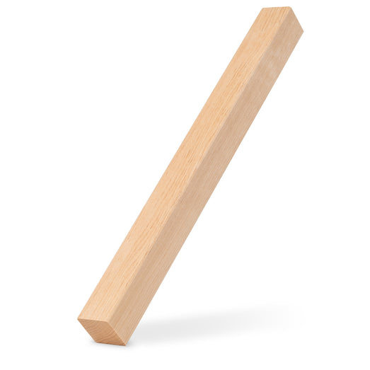 Alder 2x2 Trim piece leaning upright at an angle with a soft shadow beneath it