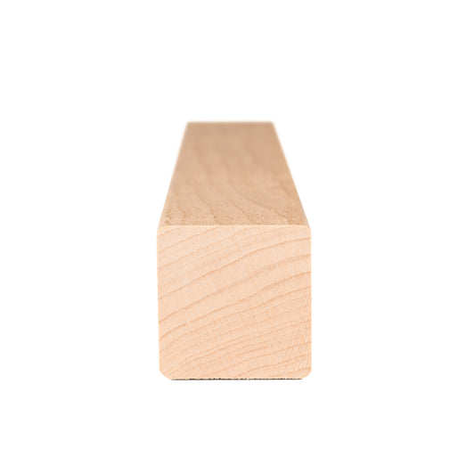 Alder 2x2 Trim piece end view showing square cross-section with curved growth rings and face grain receding