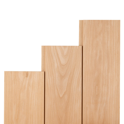 Three Alder 1x5 paneling boards of different lengths in stepped arrangement, showing face grain