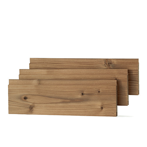 Three Thermo-Spruce 1x4 paneling boards stacked side by side in staggered positions, showing face grain and knots