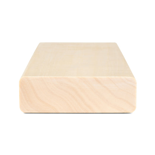 Aspen 2x4 bench board end view showing wavy grain pattern on the cut end and smooth top face
