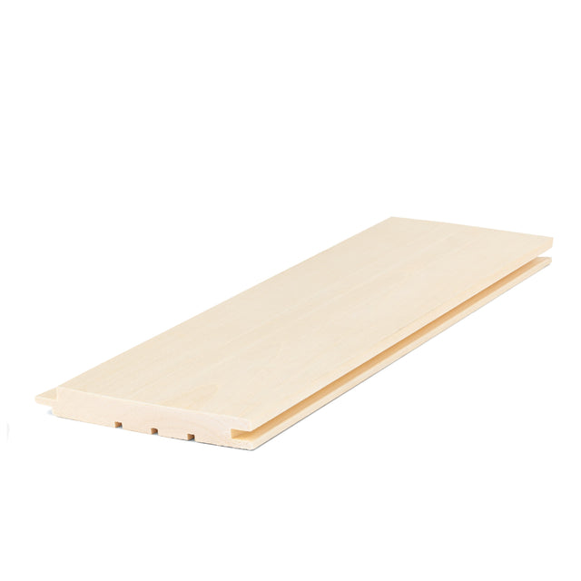 Aspen 1x5 tongue-and-groove paneling board lying at an angle, showing pale face grain and the grooved edge