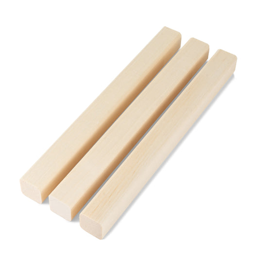 Three Aspen 2x2 Trim pieces laid side by side, showing light, even grain and square ends