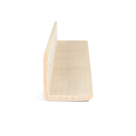 Aspen 2x2 Outside Corner Trim piece end view showing the L-shaped cross-section and visible growth rings