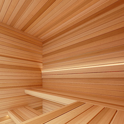 Sauna interior corner with horizontal paneling, a two-level bench and a soft strip of light along the wall