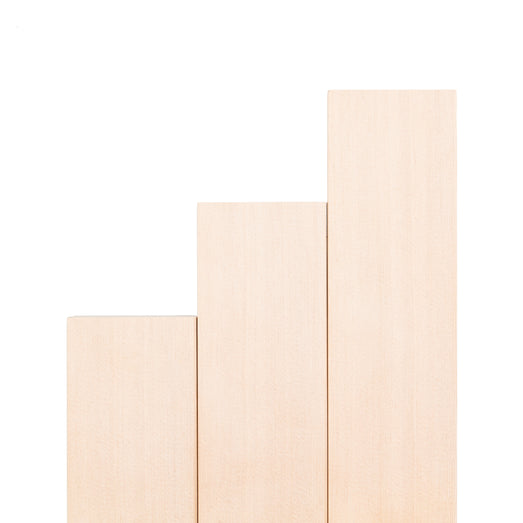 Hemlock 2x4 bench boards standing upright in stepped lengths, showing smooth face grain
