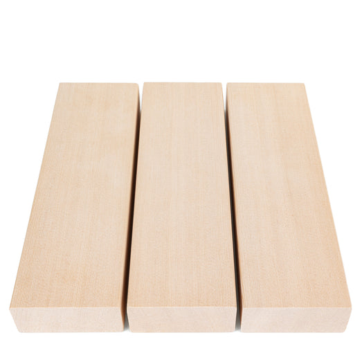 Three Hemlock 2x4 bench boards side by side from above, showing clear, smooth faces and squared ends