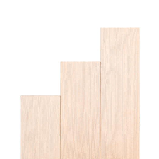 Hemlock 1x4 bench boards in three stepped lengths, standing upright side by side with straight grain