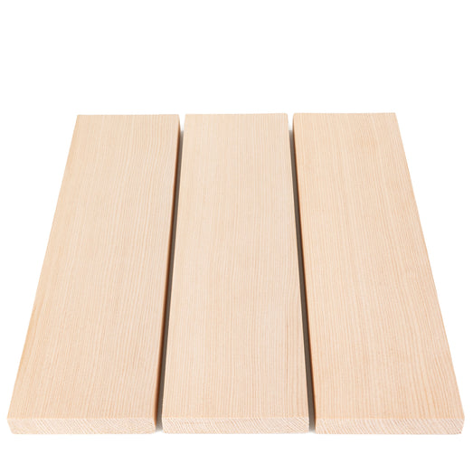 Three Hemlock 1x4 bench boards side by side with small gaps, showing face grain and end grain