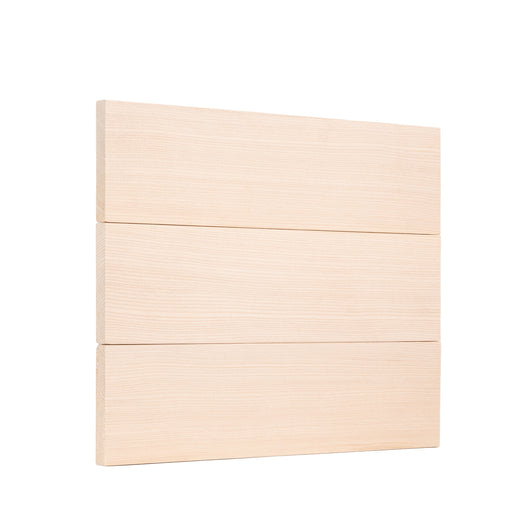 Three Hemlock 1x4 bench boards stacked flat against each other, showing horizontal face grain