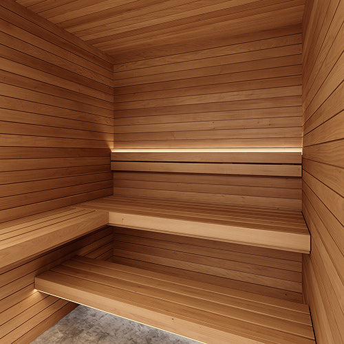 Sauna interior with horizontal paneling, two-tier benches along the back wall and a glowing light strip