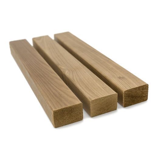 Thermo-Aspen 2x2 Trim, three pieces lying side by side at an angle, showing the faces and square cut ends