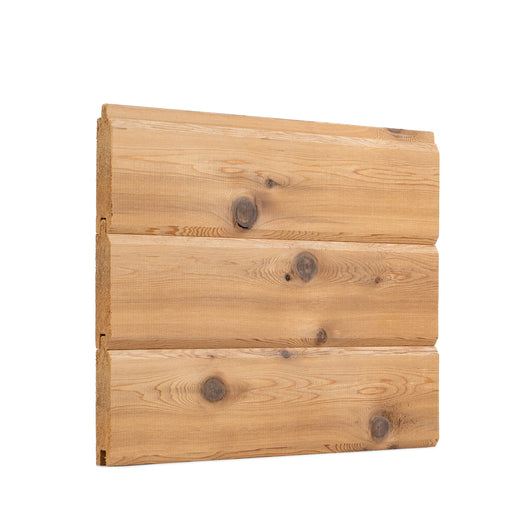 Three Western Red Cedar paneling boards joined horizontally as a wall section, with knots and V-joint seams