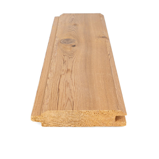 Western Red Cedar tongue-and-groove paneling board, close end view of the profile with the knotty face above