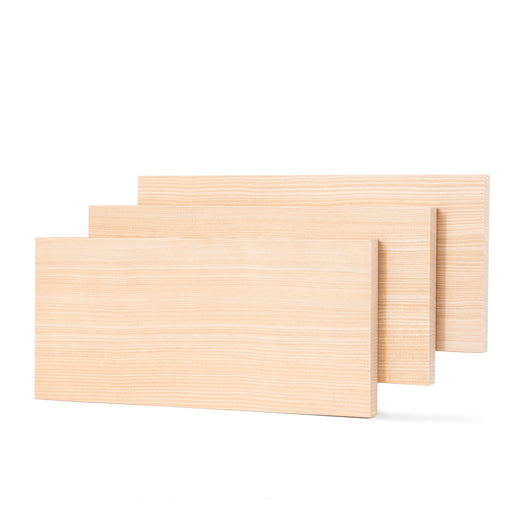 Three Hemlock 1x6 bench boards staggered upright, front board showing fine grain lines