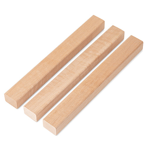 Three Alder 2x2 Trim pieces side by side at an angle, showing light face grain and squared ends
