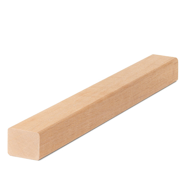 Alder 2x2 Trim piece lying flat, long angled view showing light face grain and the squared end with softly rounded edges