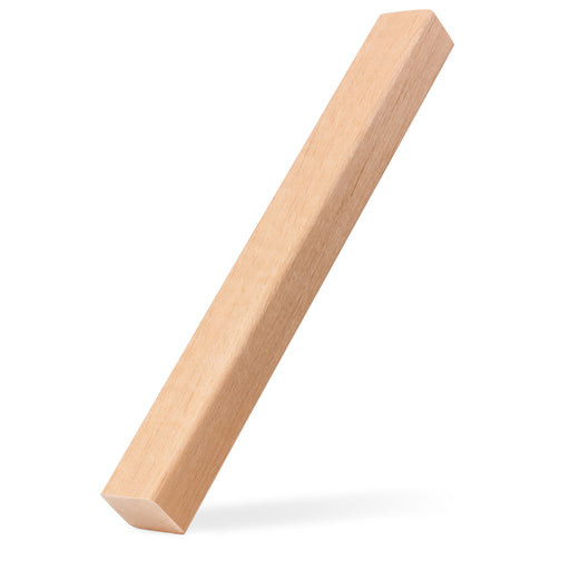 Alder 2x2 Trim piece propped upright at a slant, casting a soft shadow, showing the long face and narrow side