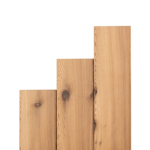 Western Red Cedar 2x4 bench boards standing upright in stepped lengths, showing vertical grain and tight knots