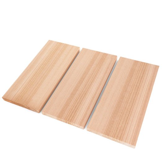 Western Red Cedar 1x6 bench boards, three laid side by side at an angle, showing straight vertical face grain