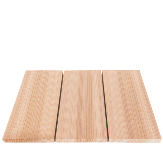 Western Red Cedar 1x6 bench boards, three laid flat in a row with narrow gaps, showing the vertical grain