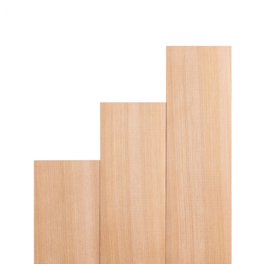 Western Red Cedar 1x4 bench boards in stepped lengths standing upright, showing vertical face grain