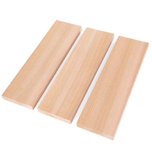 Three Western Red Cedar 1x4 bench boards laid side by side at an angle, showing straight face grain