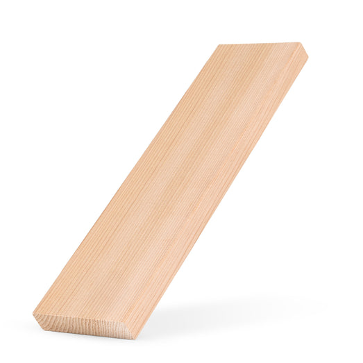 Western Red Cedar 1x4 bench board propped at a slant on white, showing the face grain and one end