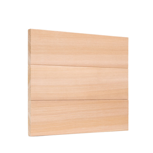 Three Western Red Cedar 1x4 bench boards stacked edge to edge as a panel, showing the horizontal grain