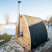 Dundalk side wall chimney on a cedar pod sauna in a snowy lakeside yard