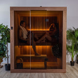 Woman relaxing on the bench inside the Dundalk Loft glass-front sauna