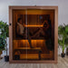 Woman relaxing on the bench inside the Dundalk Loft glass-front sauna